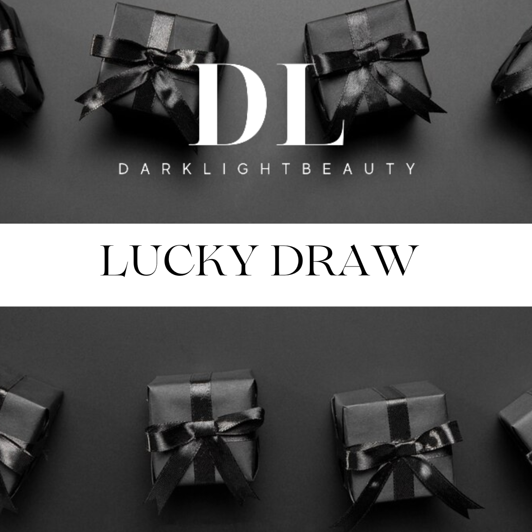 Darklight Beauty Lucky Draw promotion with gift boxes and ribbons on a dark background.