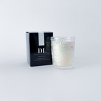 Candle with decorative packaging on a white background
