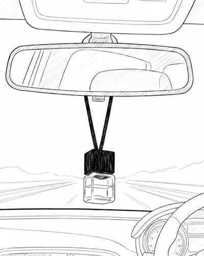 Car air freshener hanging from a car's rearview mirror on a white background