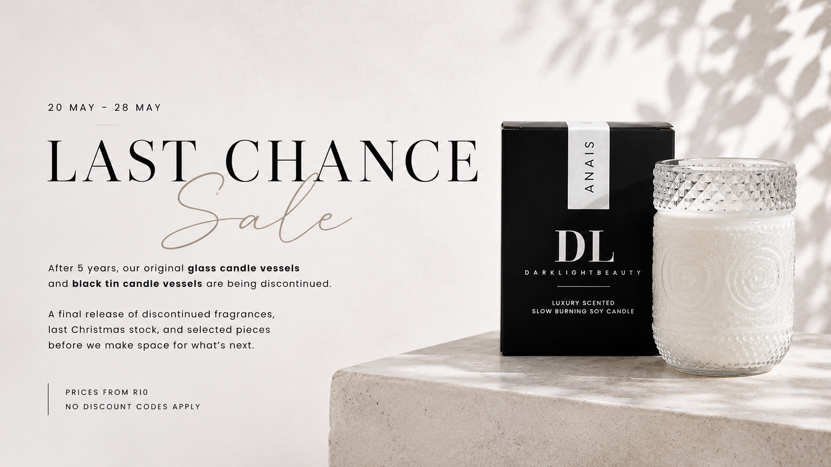 Candle with packaging on a light background, featuring 'DL' branding.